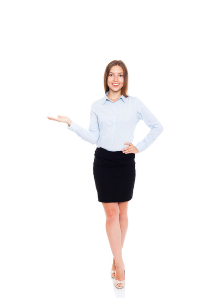 Young businesswoman smile hold open palm with empty copy space - Photo, image