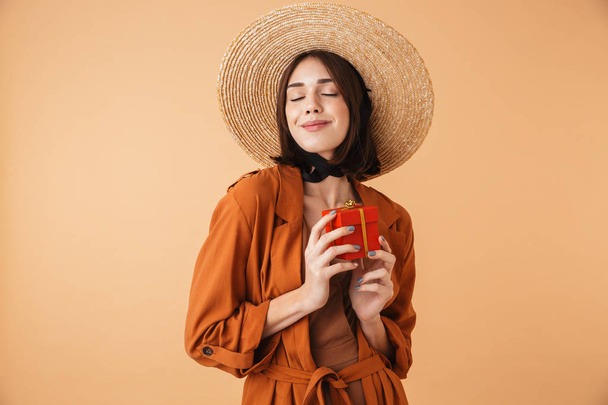 Beautiful young woman wearing straw hat - 写真・画像