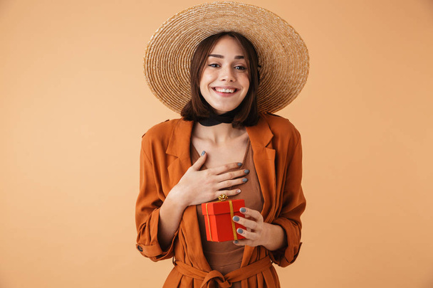 Beautiful young woman wearing straw hat - Фото, изображение