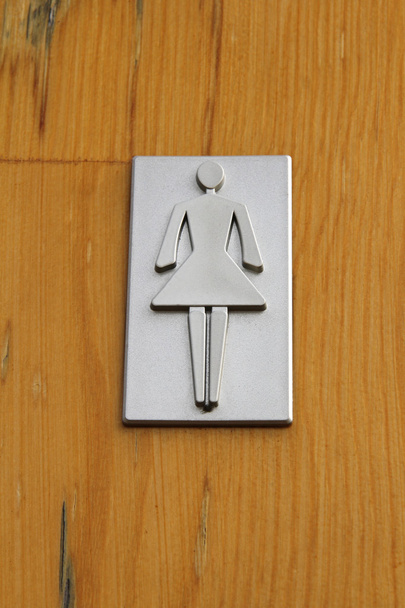Toaleta se znaménkem na dřevěné pozadí - Fotografie, Obrázek