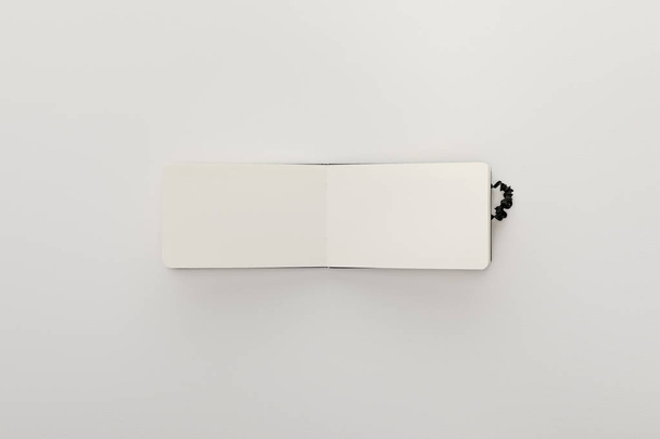 top view of blank open notebook on white background - Valokuva, kuva