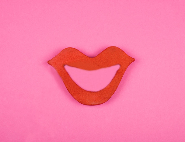 Bright red lips on a pink background - Photo, image