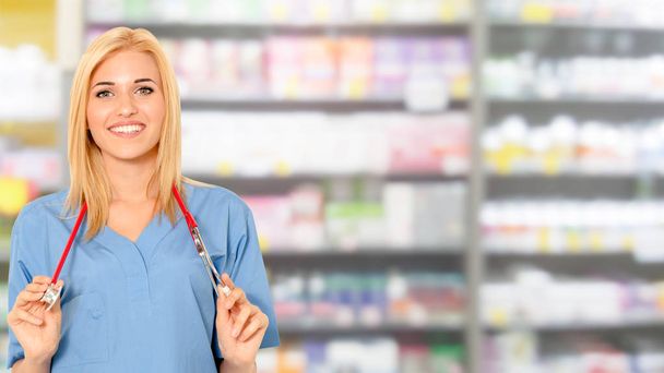 Woman pharmacist working at pharmacy. - Photo, Image