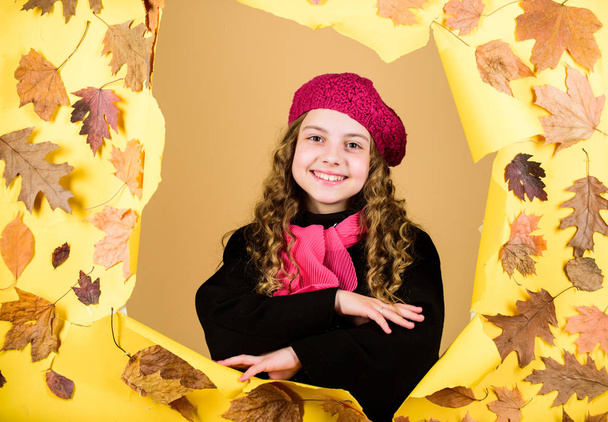 child in positive mood. parisian kid in autumn leaves. autumn beauty. Happy childhood. little girl in trendy coat and red scarf. little girl in french beret. Fall fashion. Feeling totally free - 写真・画像