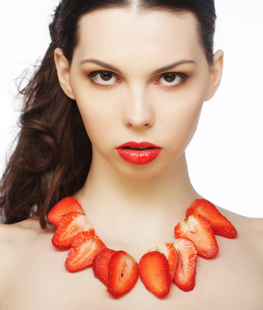 Brunette lady with strawberry - Foto, afbeelding