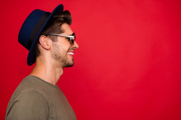Photo of amazing guy looking empty space wear vintage hat sun specs and grey t-shirt isolated on red background - Φωτογραφία, εικόνα