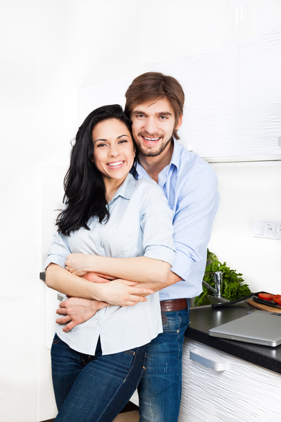 Couple at their kitchen - Фото, изображение