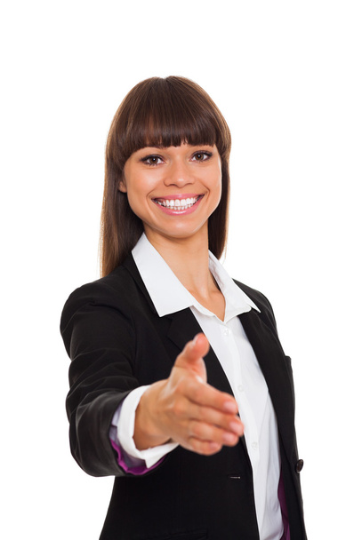 Business woman with hand extended to handshake - Foto, imagen