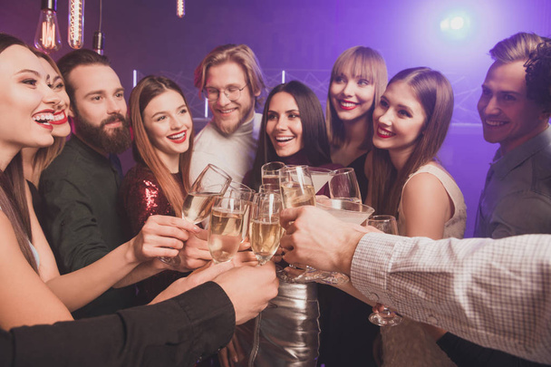 Portrait of nice chic lovely adorable glamorous fascinating luxury attractive fashionable gorgeous cheerful glad ladies and guys having fun clinking wineglasses sparkles at fogged lights nightclub - Photo, Image
