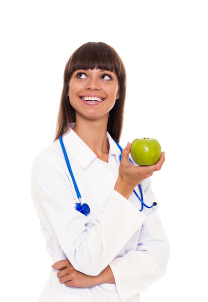 Doctor woman holding green fresh apple - Φωτογραφία, εικόνα