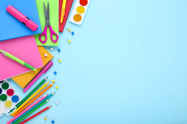 Different school supplies on blue background - Foto, immagini