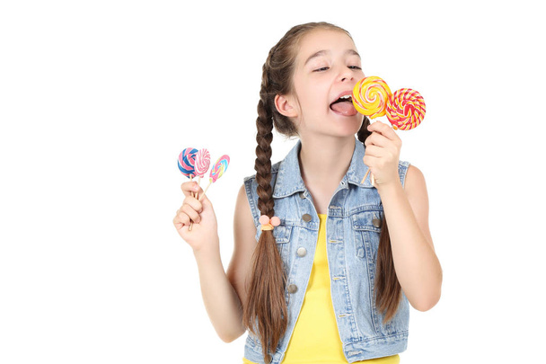 Beautiful young girl with sweet lollipops on white background - Foto, Imagen