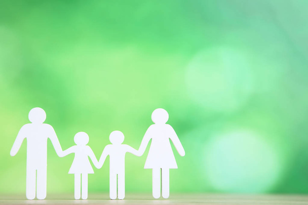 Family figures on green background - Foto, Imagem