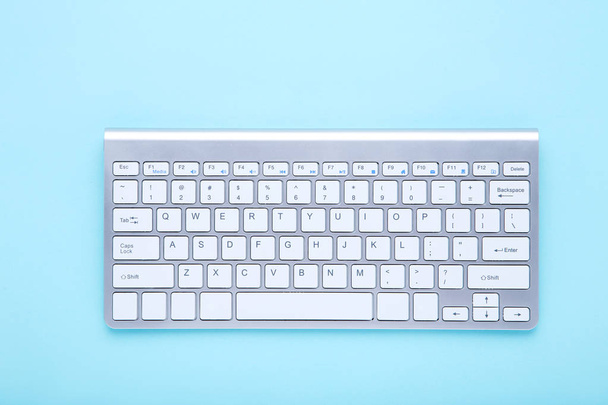 Computer keyboard on blue background - Фото, зображення