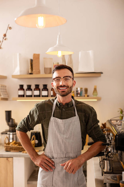 Entrepreneur owning coffee shop standing near coffee machine - Foto, immagini