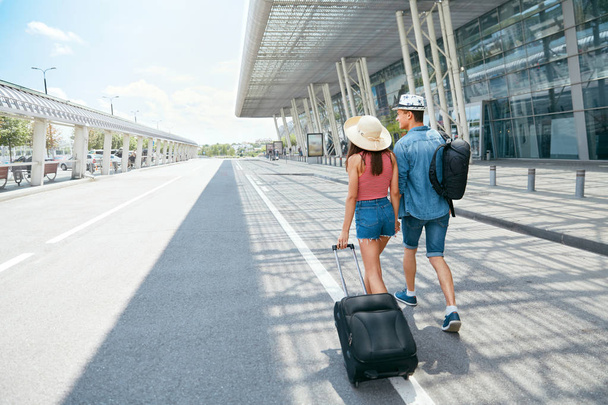 Travel. Couple Near Airport With Suitcase Traveling In Summer - Фото, изображение