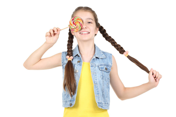 Beautiful young girl with sweet lollipop on white background - Foto, Imagem