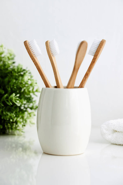 Bamboo toothbrushes in the bathroom - Zdjęcie, obraz