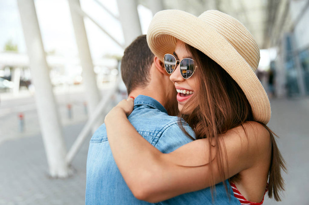 Traveling Couple Embracing In Airport. - Fotó, kép