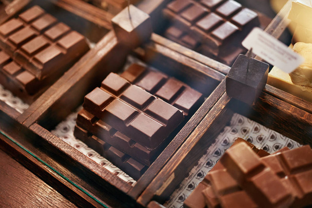 Chocolate Bars In Confectionery Shop Closeup. - Фото, изображение