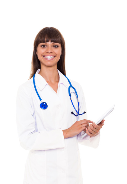 Medical doctor woman smile write on blue with stethoscope - Φωτογραφία, εικόνα