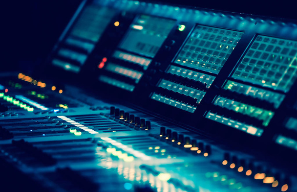 Professional concert sound mixer panel with sliders and regulato - Foto, Bild