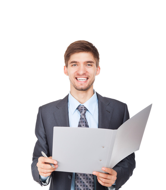 Handsome young business man happy smile writing on clipboard sign up contract - Zdjęcie, obraz