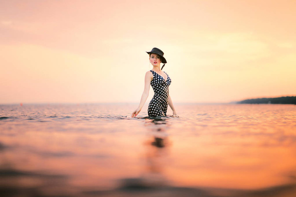 Happy Carefree Woman Enjoying Beautiful Sunset on the Beach - Fotó, kép