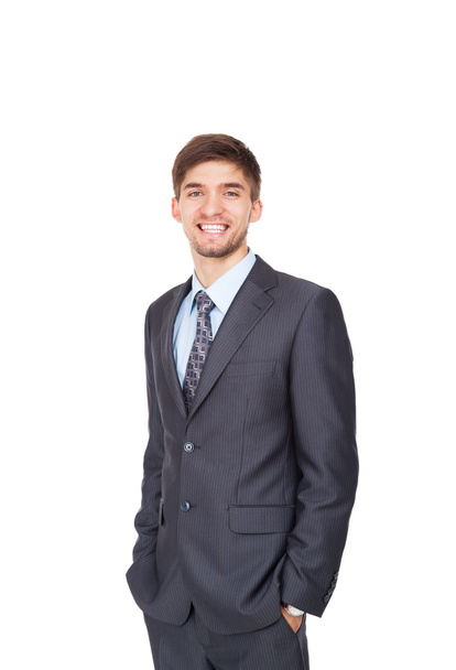 Молодий бізнесмен щаслива посмішка з руками в кишенях
 - Фото, зображення