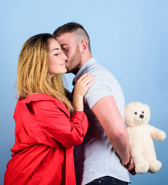 Gift with love. couple in love. family relations and happiness. family values. valentines day present. sexy girl and man hold teddy bear. romantic relationship. love date. man and woman embrace - Zdjęcie, obraz