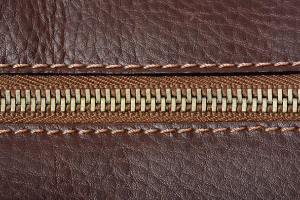 Textura de cuero marrón y fondo con cremallera
 - Foto, Imagen