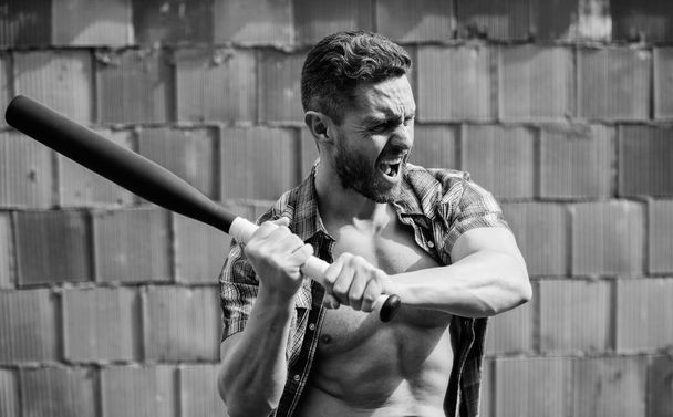 full of energy. unshaven muscular man fighting. man with baseball bat. i am a criminal. sport activity. Hooligan man hits the bat. Bandit gang and conflict. aggression and anger. Full concentration - Foto, Bild