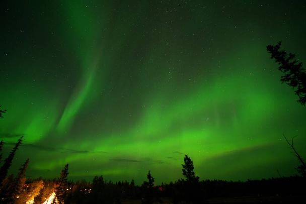 Yellowknife,Canada-August, 2019: Aurora borealis or Northern lights observed in Yellowknife, Canada, on August, 2019 - Фото, зображення