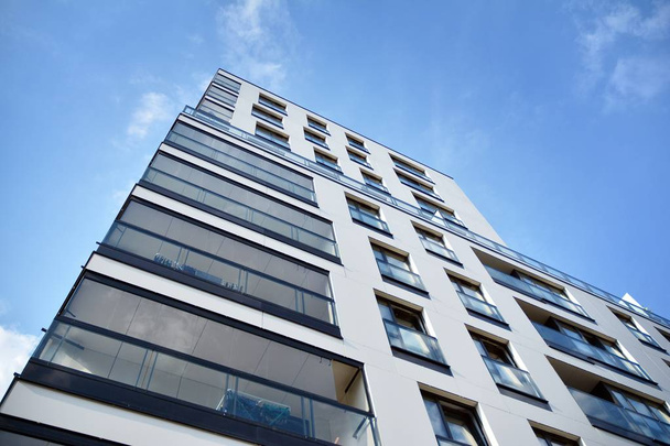 Modern and new apartment building. Multistoried modern, new and stylish living block of flats. - Valokuva, kuva