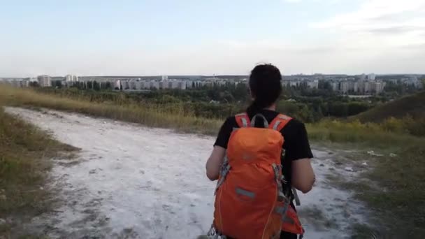 young woman tourist  with backpack walking   - Materiaali, video