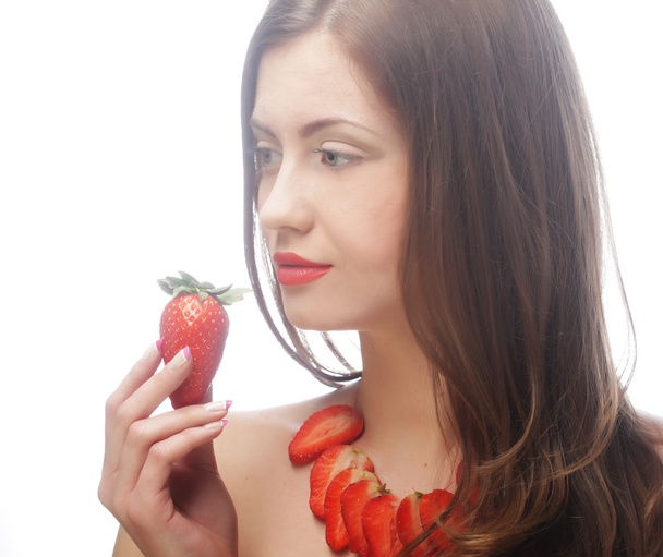 Sexy lady holding a juicy strawberry - Zdjęcie, obraz