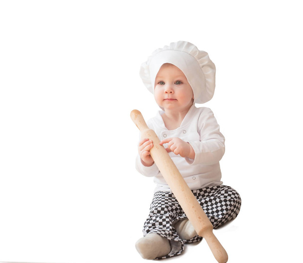 Bambino, bambino in costume da cuoco cuoco con mattarello
 - Foto, immagini