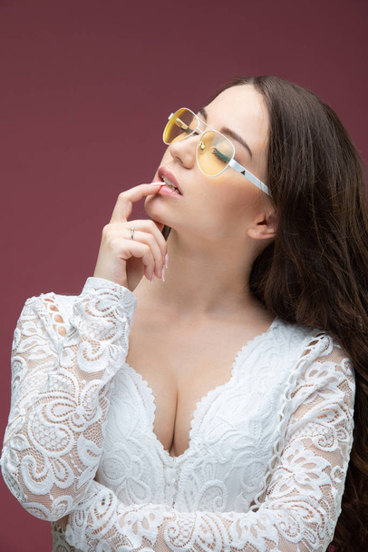 Portrait of a beautiful girl in glasses with a smile - Фото, зображення