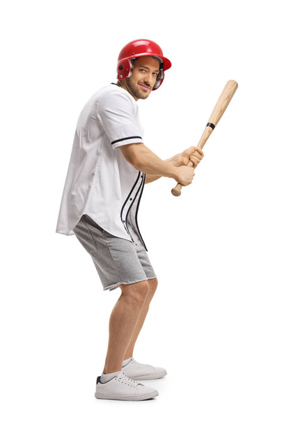 Man playing baseball and holding a bat - Foto, Imagen