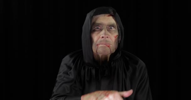 Old executioner Halloween makeup and costume. Elderly man with blood on his face - Footage, Video