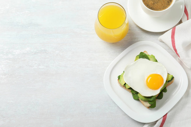 Delicious breakfast with fried egg served on table, flat lay. Space for text - Foto, Imagen