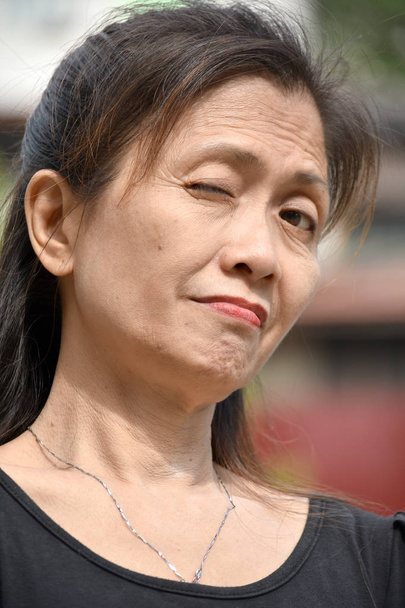 A Winking Older Asian Female Senior - Foto, Bild