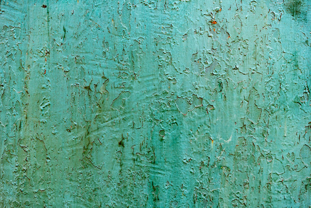 Metal texture with scratches and cracks which can be used as a background - Fotografie, Obrázek