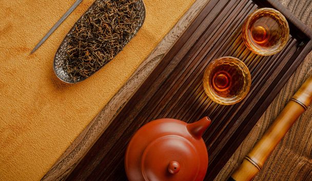 tea table with instruments teapots cups pancake and tea Shen Puer - Photo, Image