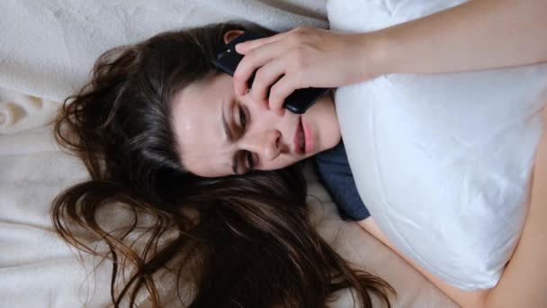 Frustrated female feeling upset desperate talking on the phone, having emotional problems, fears, psychological therapy, lack of sleep hearing bad news during mobile conversation at home - Filmagem, Vídeo