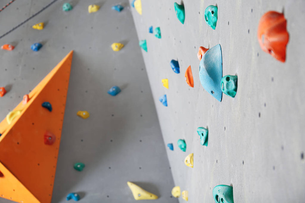 Walls with climbing holds in gym - Фото, зображення