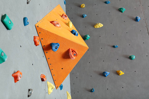 Walls with climbing holds in gym - Фото, зображення