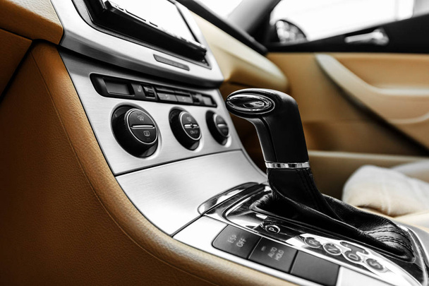 white automatic gear stick of a modern car, car interior details - Фото, изображение