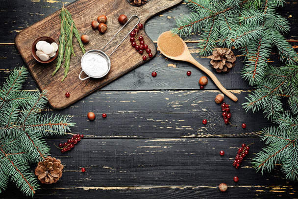 Ingredients for Christmas pie on dark wooden background - Photo, Image