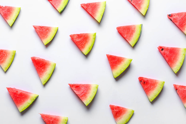 Many slices of watermelon on white background - 写真・画像